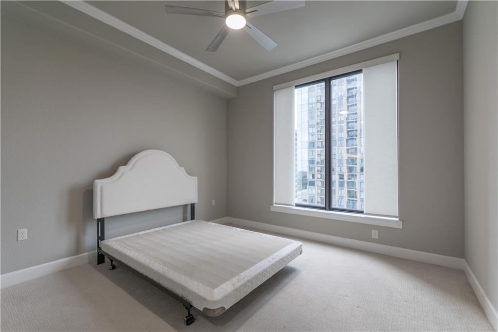 3445 Stratford Road Northeast, Unit 2107 Atlanta, GA 30326 - Photo 11 of 22 a bedroom with a bed and a window
