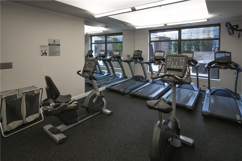 3445 Stratford Road Northeast, Unit 2107 Atlanta, GA 30326 - Photo 17 of 22 a view of a room with gym equipment