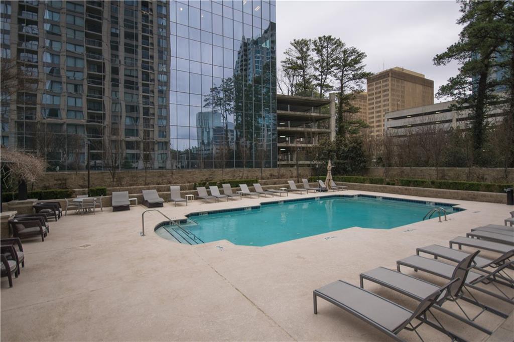 3445 Stratford Road Northeast, Unit 2107 Atlanta, GA 30326 - Photo 20 of 22 a view of a swimming pool with a patio