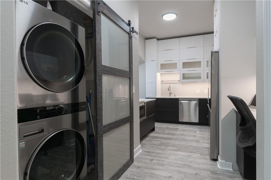 3445 Stratford Road Northeast, Unit 2107 Atlanta, GA 30326 - Photo 2 of 22 a kitchen with a washer and dryer