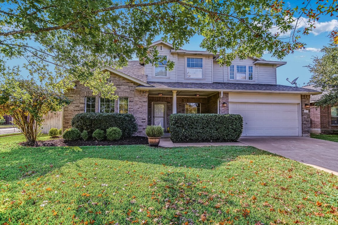 3231 Foothills Trail Round Rock, TX 78681 - Photo 1 of 25 Front view of the house, front yard, beautiful trees and great landscaping.