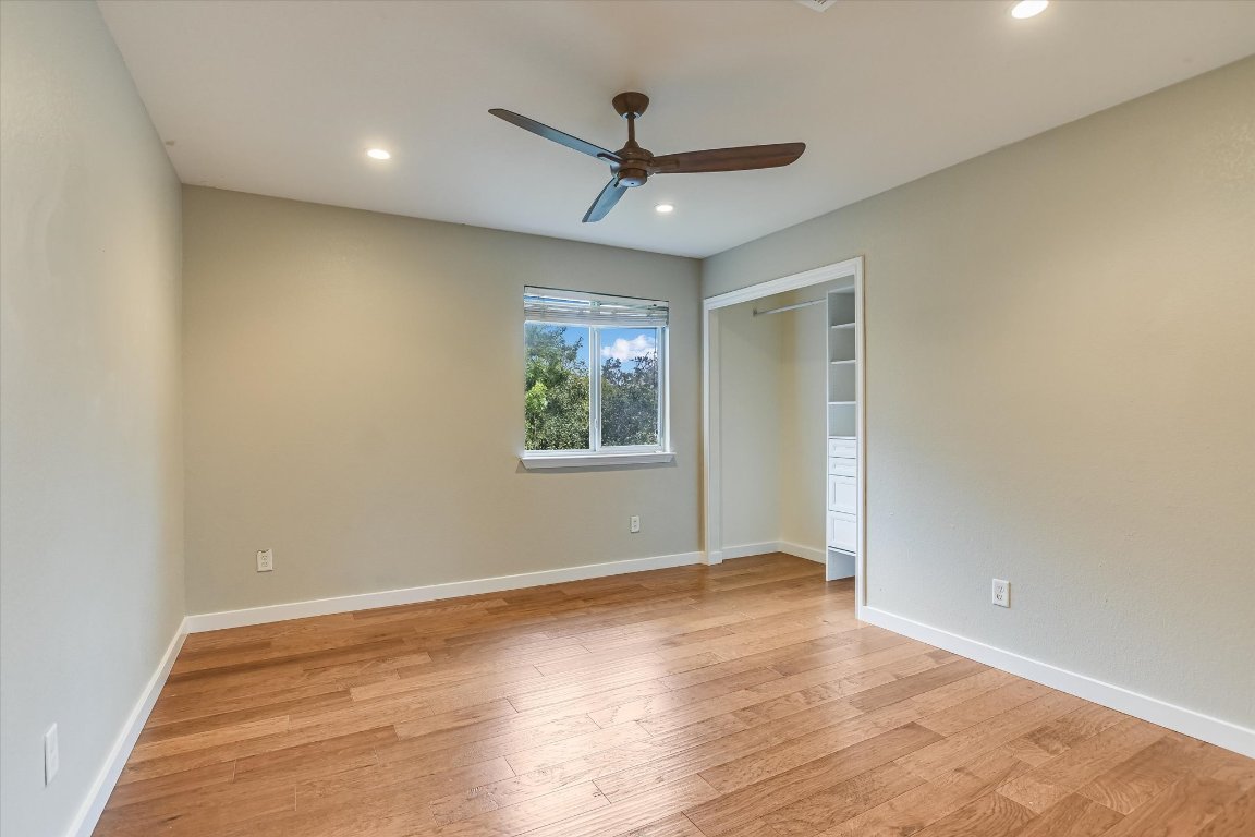 3231 Foothills Trail Round Rock, TX 78681 - Photo 13 of 25 3rd bedroom has hardwood flooring, modern ceiling fan, recessed lighting.