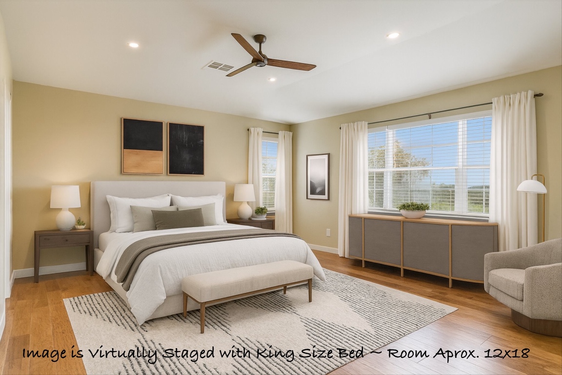 3231 Foothills Trail Round Rock, TX 78681 - Photo 15 of 25 Primary Bedroom:
Virtually Staged with King Sized Bed, side tables, dresser and seating area.