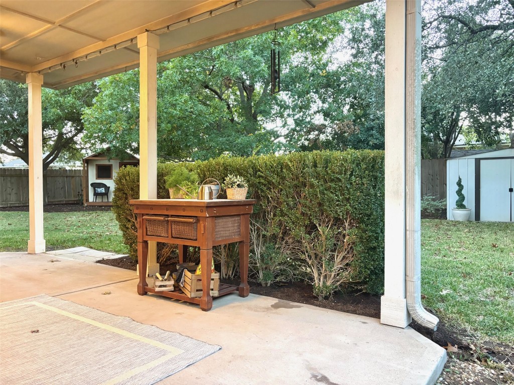 3231 Foothills Trail Round Rock, TX 78681 - Photo 18 of 25 Covered Patio with a ceiling fan has a great view of the backyard. Lots of room to entertain.