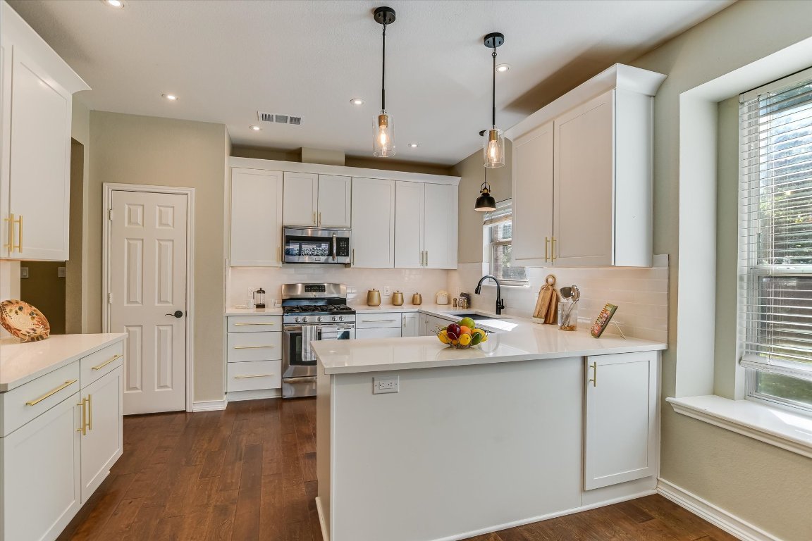 3231 Foothills Trail Round Rock, TX 78681 - Photo 6 of 25 New cabinets with lots of storage ,new sink, pantry and quartz counter tops, new backsplash, and recessed lighting.
