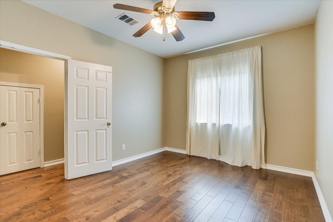 3231 Foothills Trail Round Rock, TX 78681 - Photo 8 of 25 Great Guest Room on main floor. Engineered hardwood and ceiling fan.
Room approximately 11 x 14 Ft