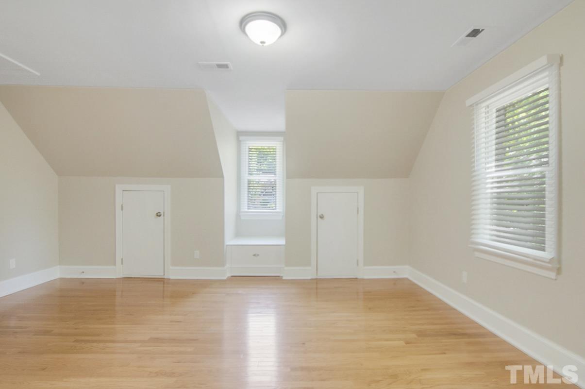 500 Chapwith Road Garner, NC 27529 - Photo 21 of 28 an empty room with wooden floor and windows