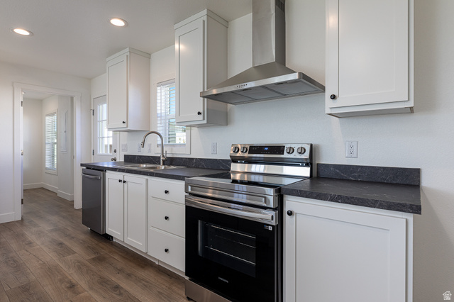 749 Riddle Drive Fredonia, AZ 86022 - Photo 3 of 41 Kitchen with stainless steel appliances, dark countertops, dark wood finished floors, white cabinets, and recessed lighting