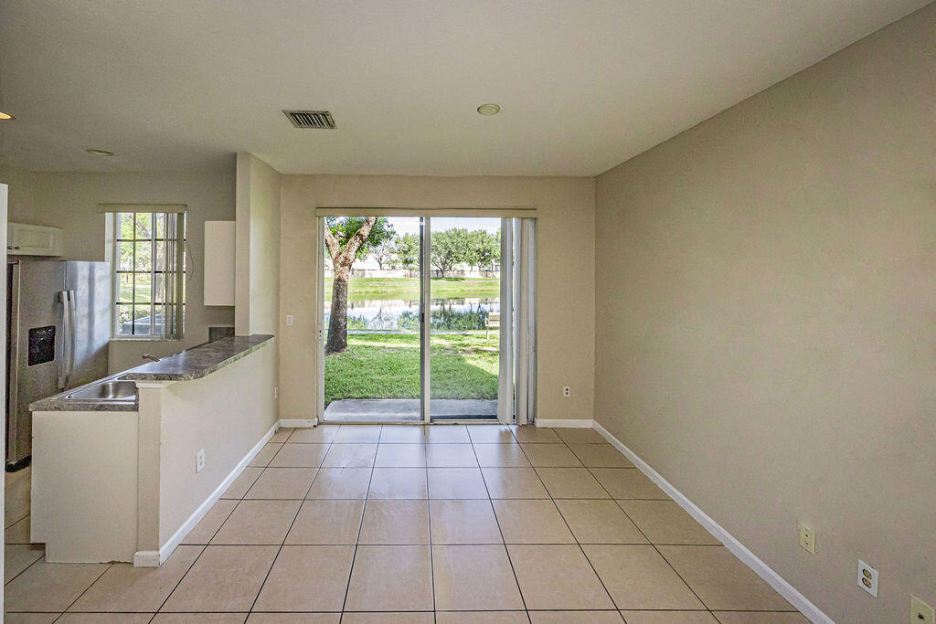 970 Tortuga Drive Riviera Beach, FL 33404 - Photo 11 of 37 a view of an empty room and window