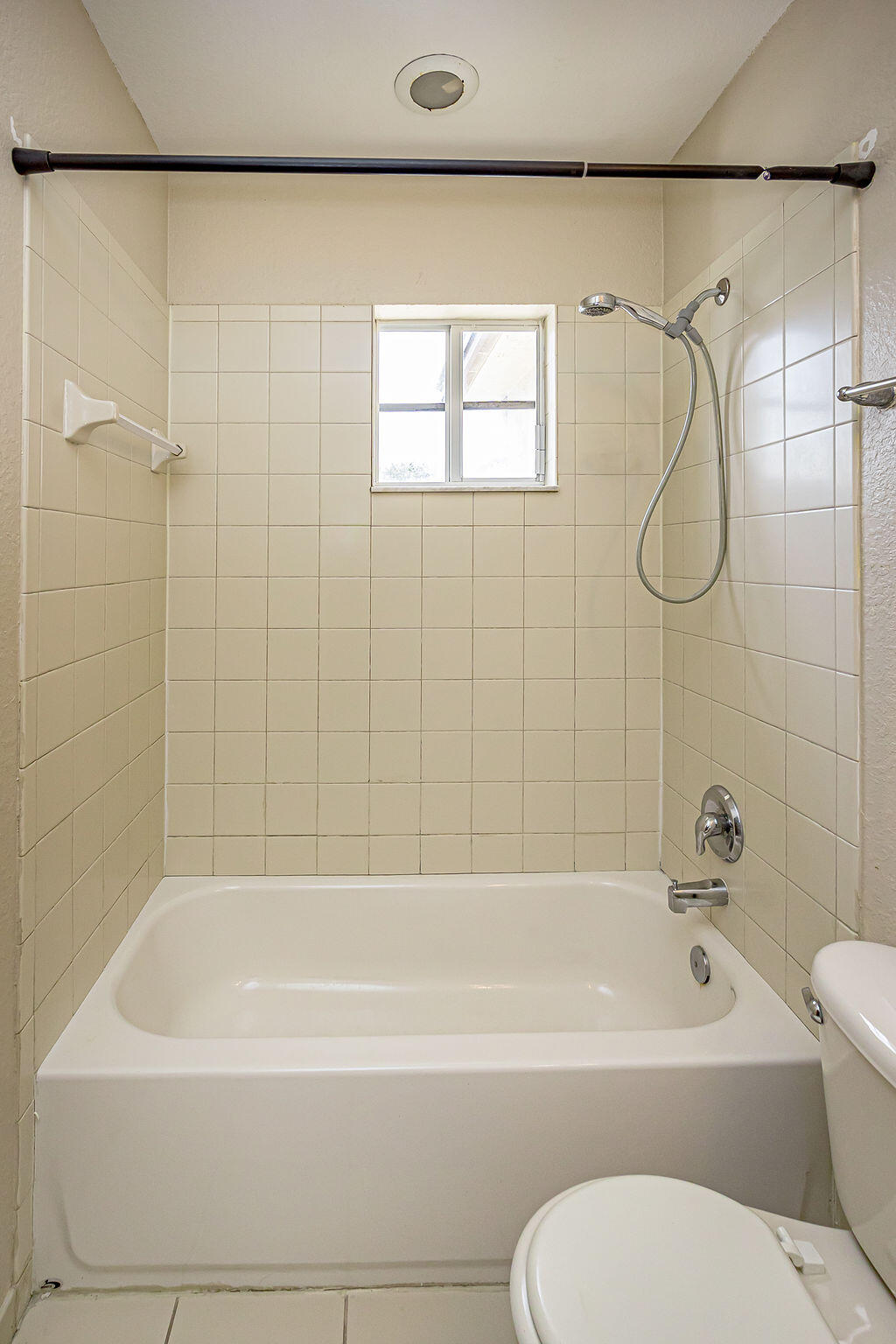 970 Tortuga Drive Riviera Beach, FL 33404 - Photo 19 of 37 a bathroom with a toilet bathtub and shower