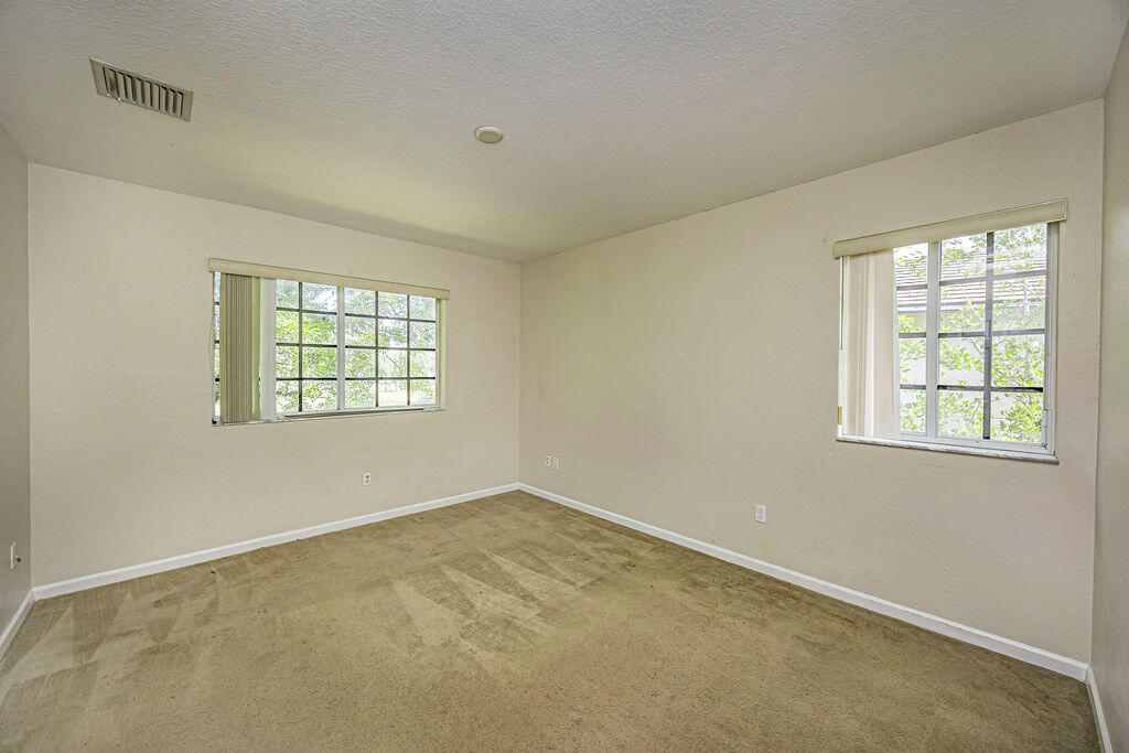970 Tortuga Drive Riviera Beach, FL 33404 - Photo 21 of 37 an empty room with windows