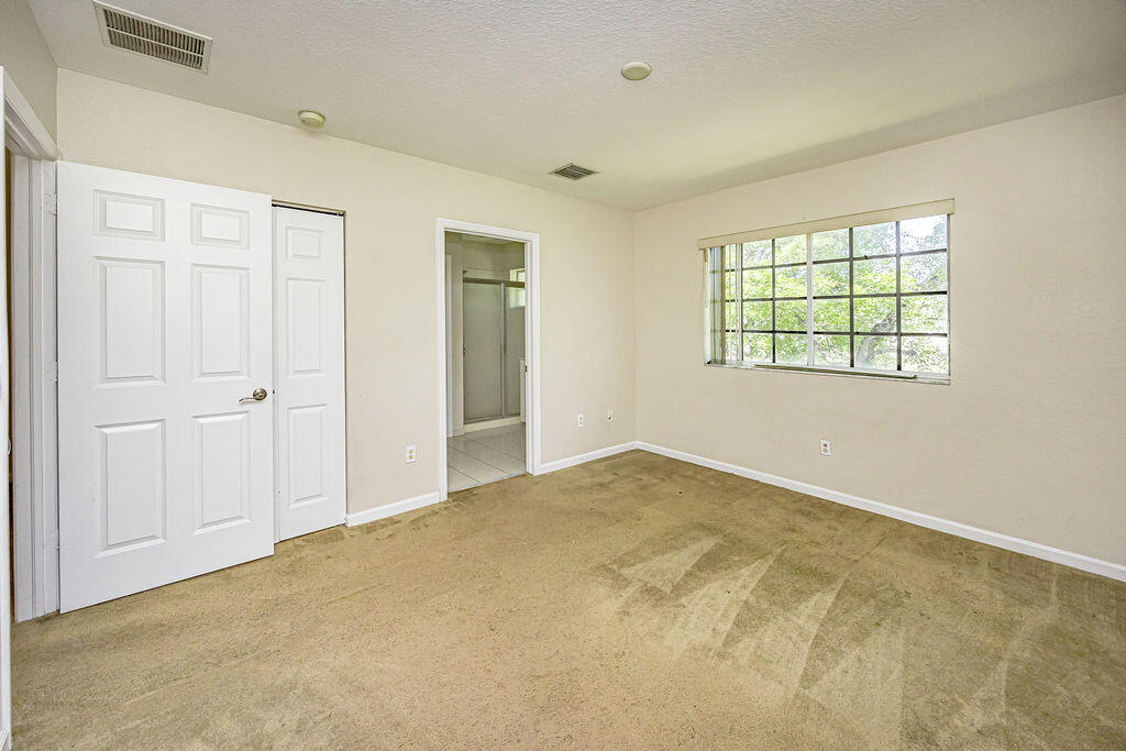 970 Tortuga Drive Riviera Beach, FL 33404 - Photo 22 of 37 a view of an empty room with a window