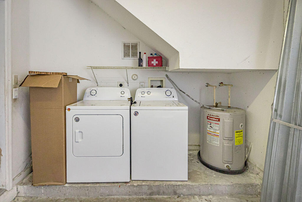 970 Tortuga Drive Riviera Beach, FL 33404 - Photo 32 of 37 a utility room with dryer and washer