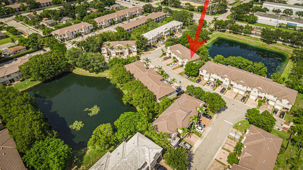 970 Tortuga Drive Riviera Beach, FL 33404 - Photo 35 of 37 an aerial view of a residential houses with outdoor space