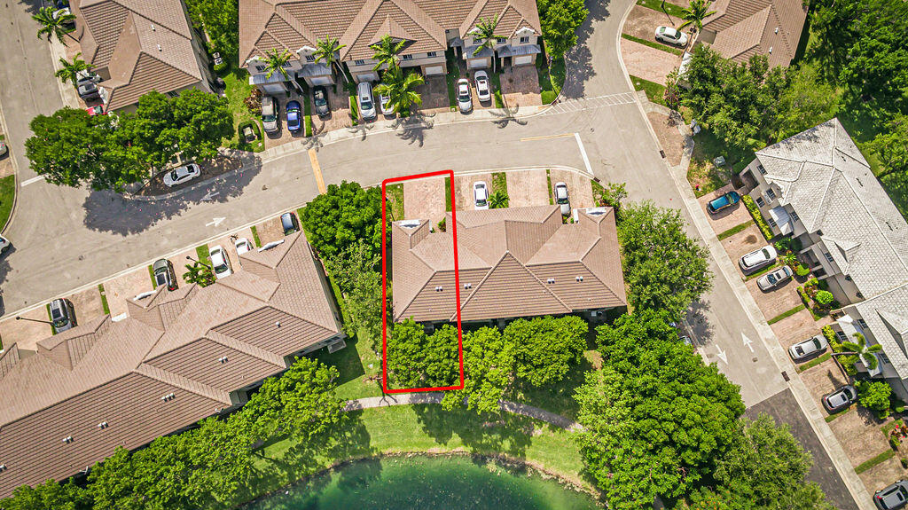 970 Tortuga Drive Riviera Beach, FL 33404 - Photo 37 of 37 an aerial view of a house with yard and garden