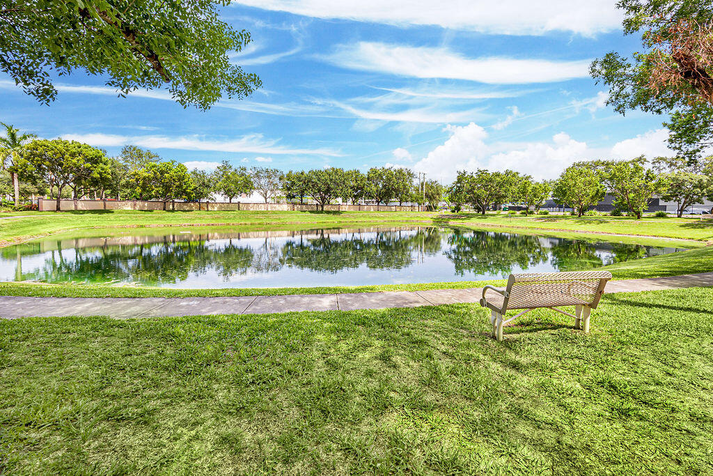 970 Tortuga Drive Riviera Beach, FL 33404 - Photo 6 of 37 a view of a lake with a big yard