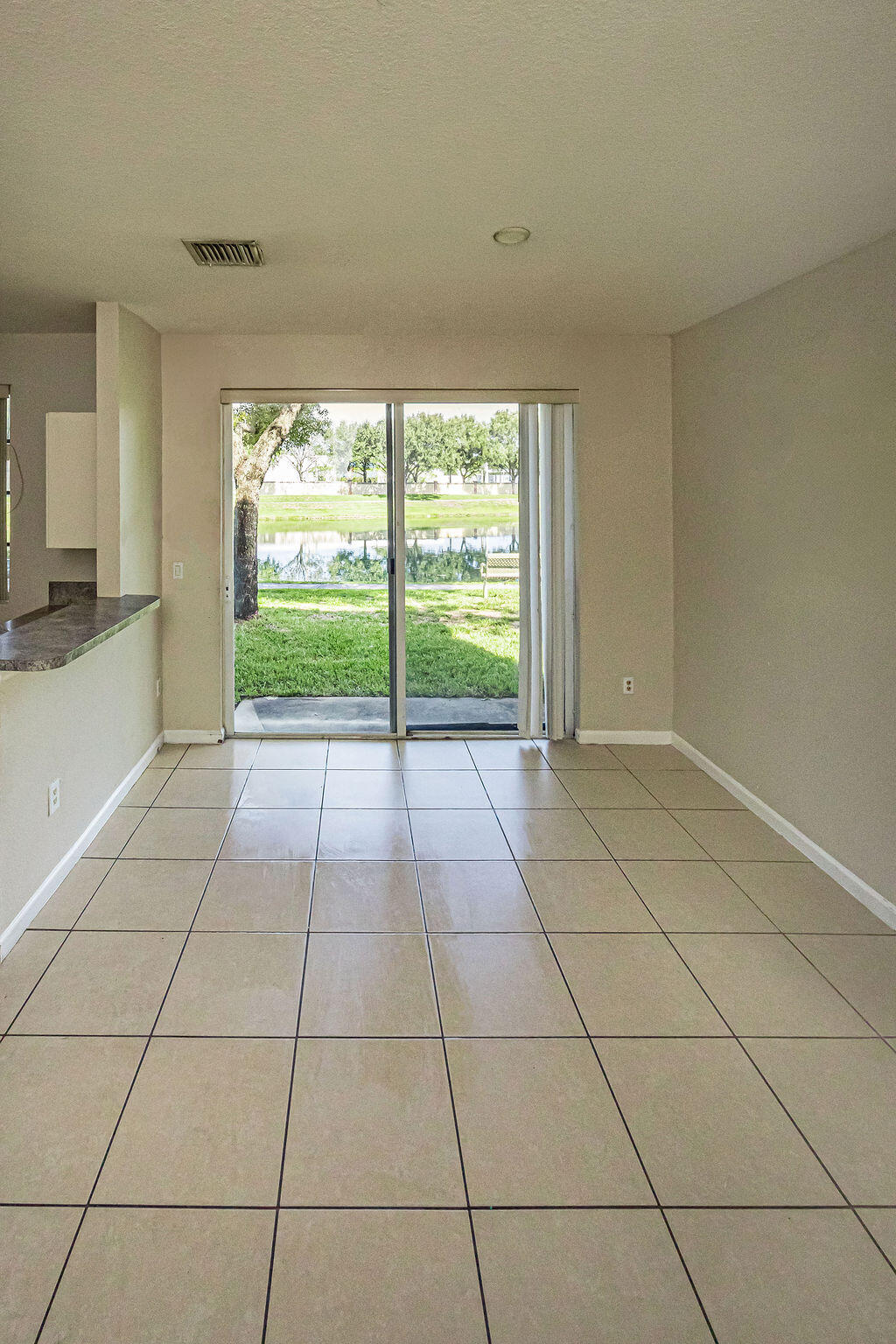 970 Tortuga Drive Riviera Beach, FL 33404 - Photo 10 of 37 a view of an empty room and window