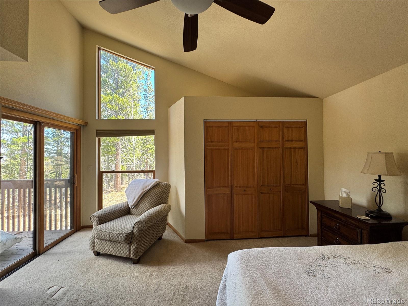 70 Highpoint Circle Black Hawk, CO 80422 - Photo 17 of 37 a bedroom with a bed and a chandelier
