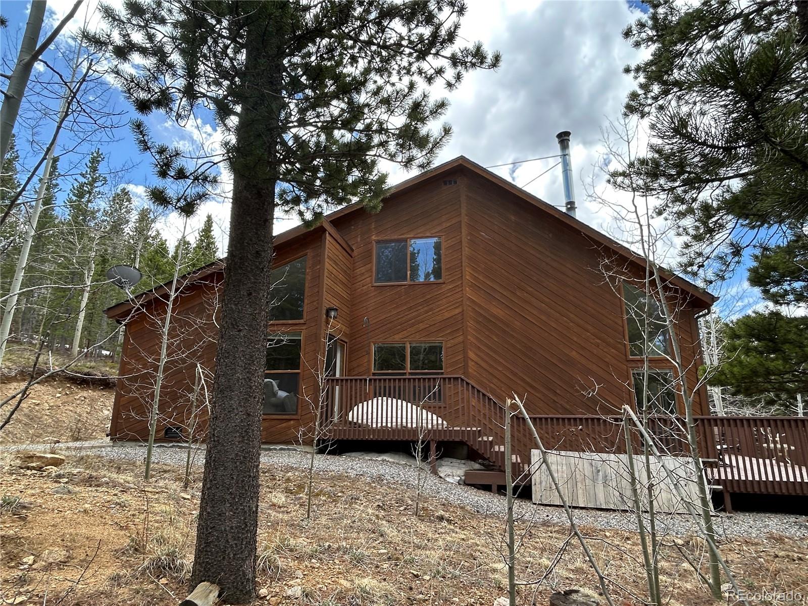 70 Highpoint Circle Black Hawk, CO 80422 - Photo 2 of 37 a front view of a house with garden