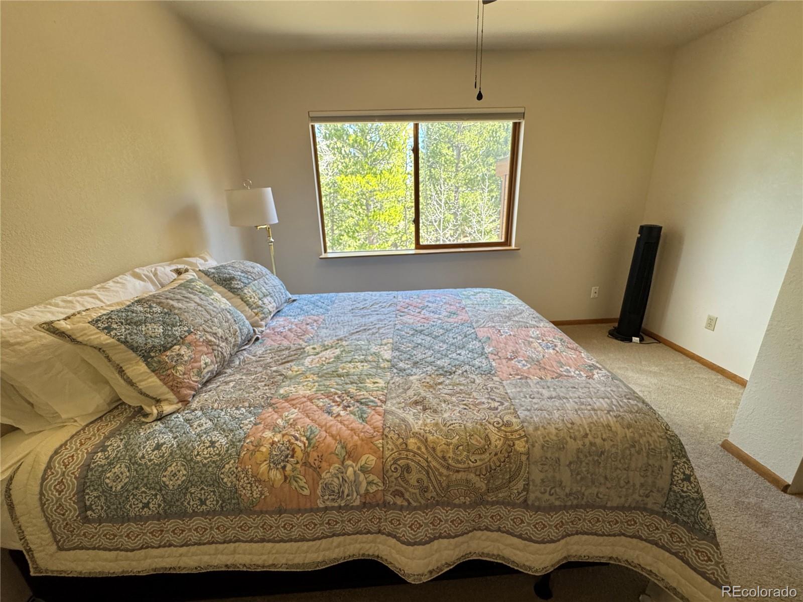 70 Highpoint Circle Black Hawk, CO 80422 - Photo 23 of 37 a bedroom with a bed and window