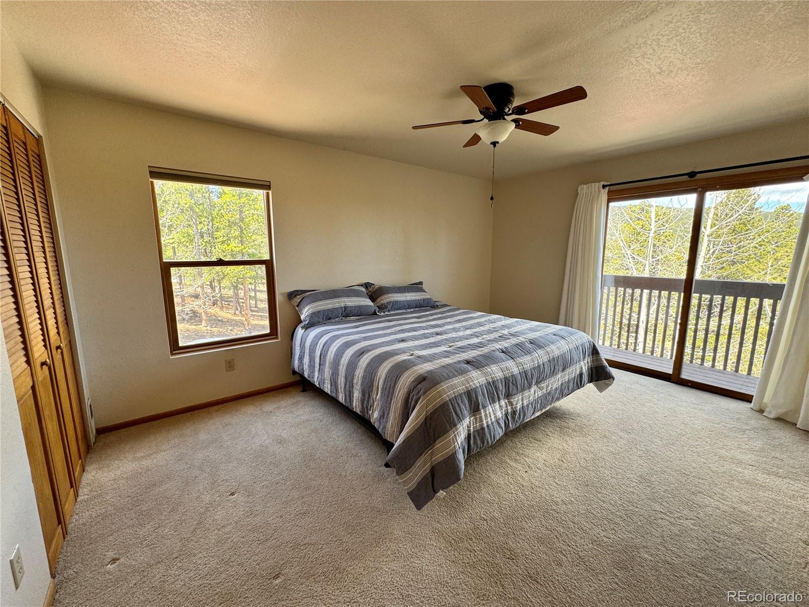 70 Highpoint Circle Black Hawk, CO 80422 - Photo 26 of 37 a bedroom with a bed and a large window
