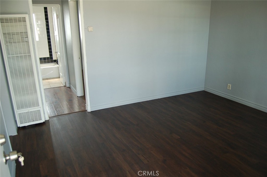 422 West Palm Street, Unit 424 1/2D Compton, CA 90220 - Photo 16 of 17 an empty room with wooden floor