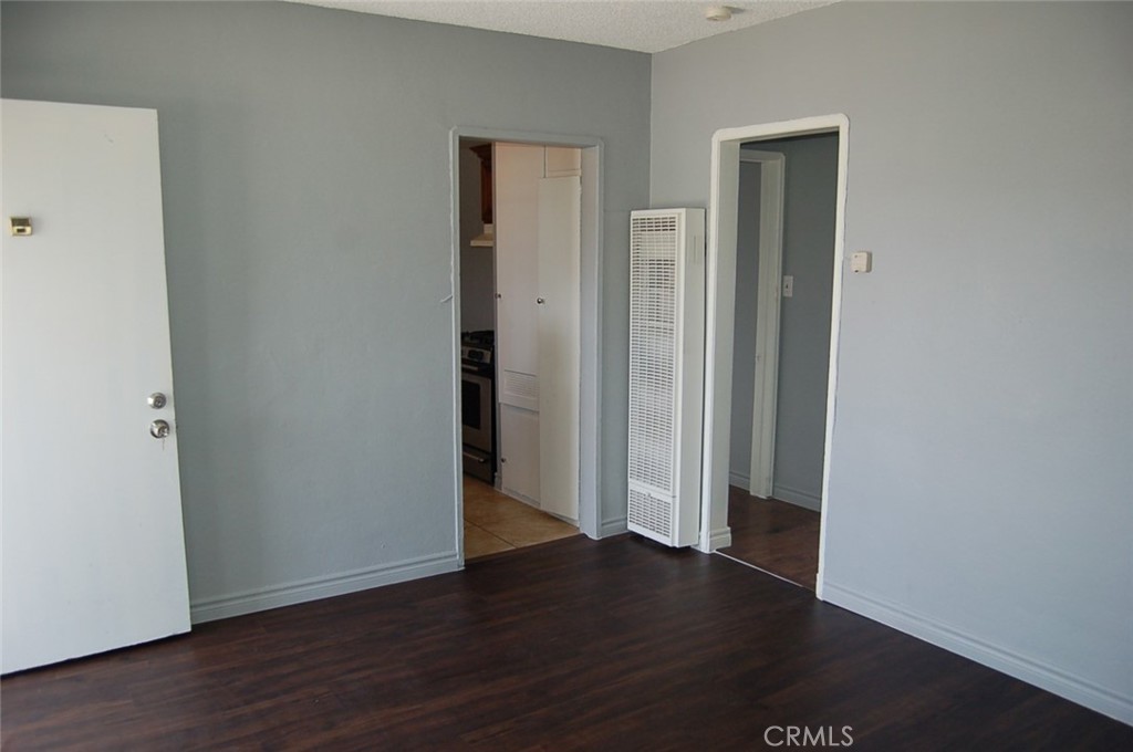 422 West Palm Street, Unit 424 1/2D Compton, CA 90220 - Photo 5 of 17 an empty room with wooden floor & closet area