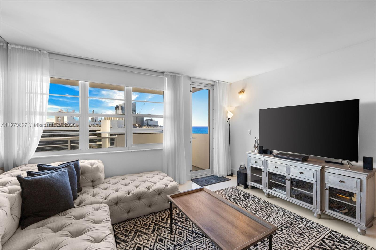 100 Lincoln Road, Unit 1523/1525 Miami Beach, FL 33139 - Photo 11 of 35 a living room with furniture and a flat screen tv