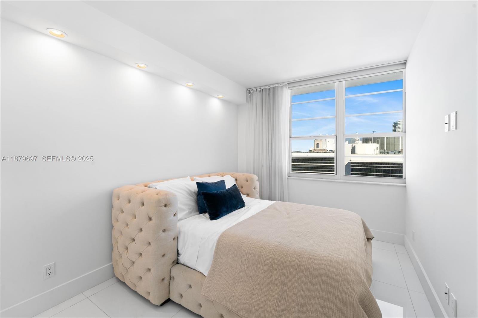 100 Lincoln Road, Unit 1523/1525 Miami Beach, FL 33139 - Photo 12 of 25 a bedroom with a bed and kitchen view