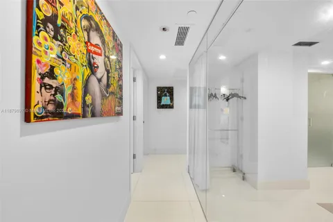 a bathroom with a mirror and a shower