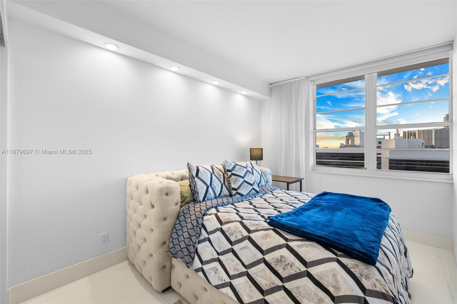 100 Lincoln Road, Unit 1523/1525 Miami Beach, FL 33139 - Photo 18 of 35 a bedroom with furniture and large window