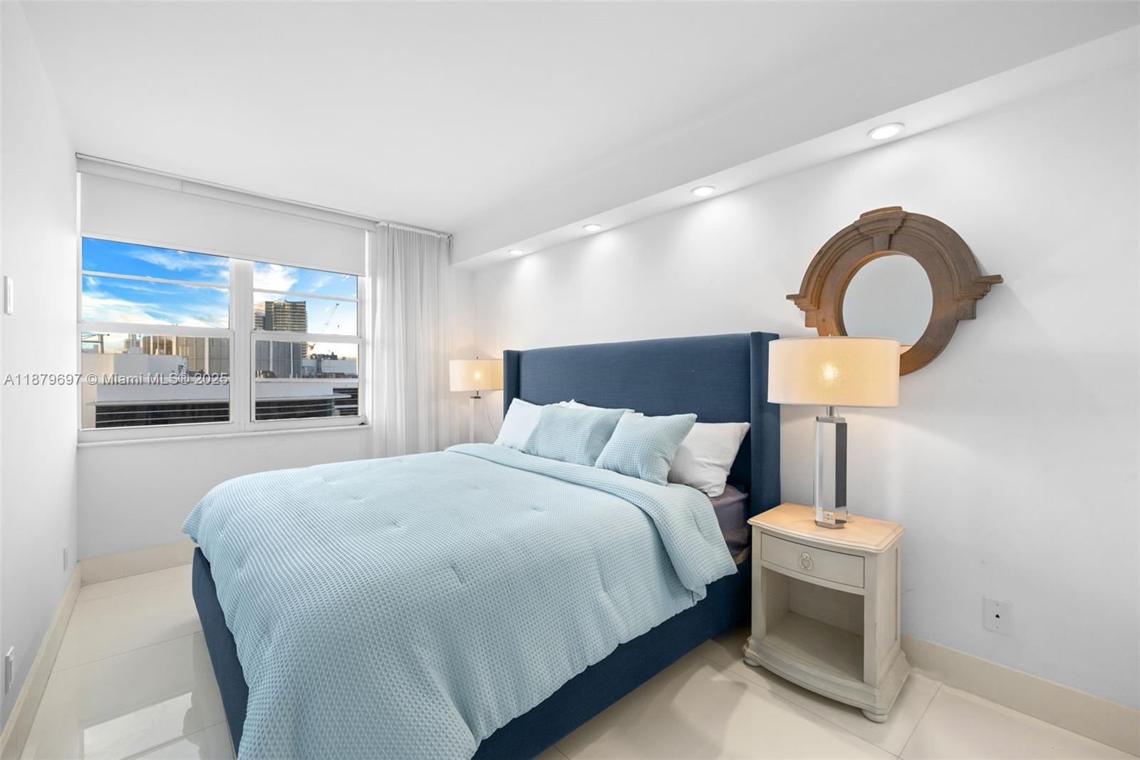 100 Lincoln Road, Unit 1523/1525 Miami Beach, FL 33139 - Photo 19 of 35 a bedroom with a bed and a large window