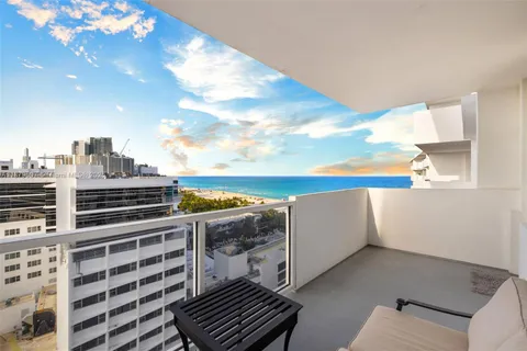 a view of roof with city view