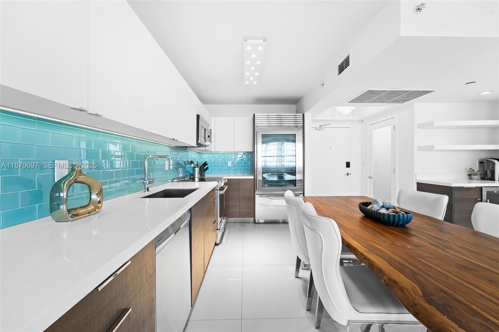 100 Lincoln Road, Unit 1523/1525 Miami Beach, FL 33139 - Photo 4 of 25 a kitchen with a sink appliances and cabinets