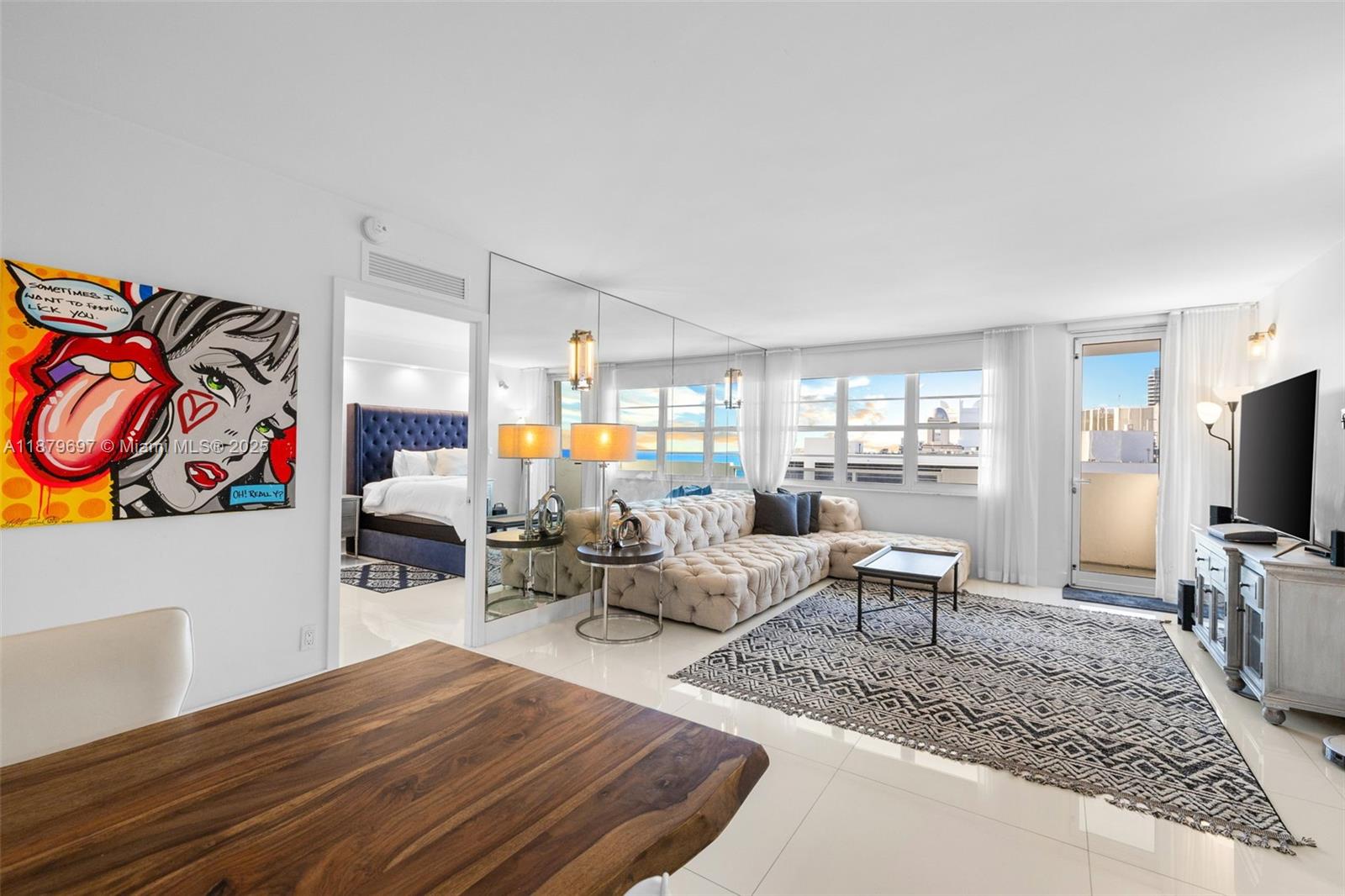 100 Lincoln Road, Unit 1523/1525 Miami Beach, FL 33139 - Photo 7 of 35 a living room with furniture and a flat screen tv