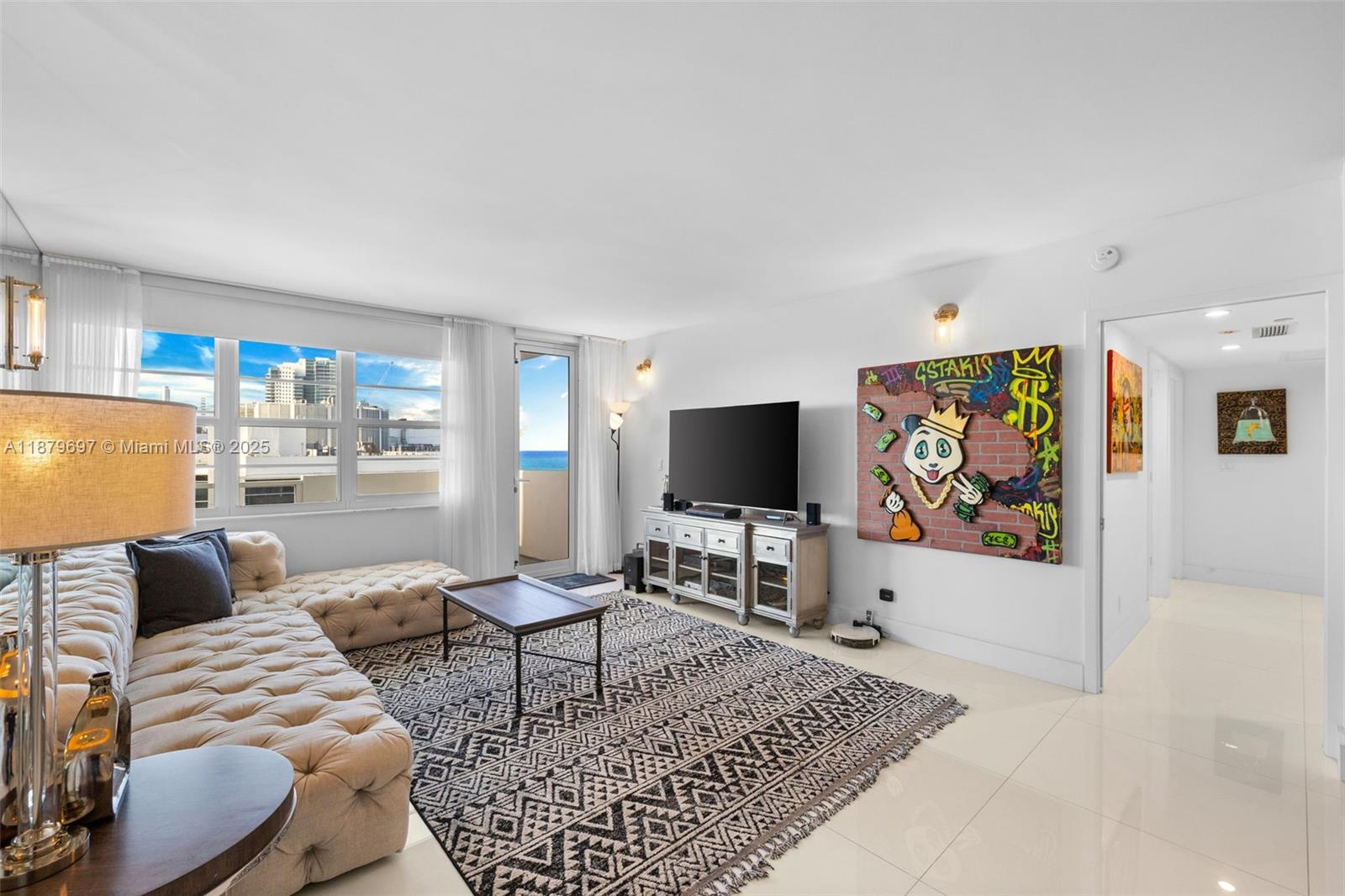 100 Lincoln Road, Unit 1523/1525 Miami Beach, FL 33139 - Photo 8 of 35 a living room with furniture and a flat screen tv