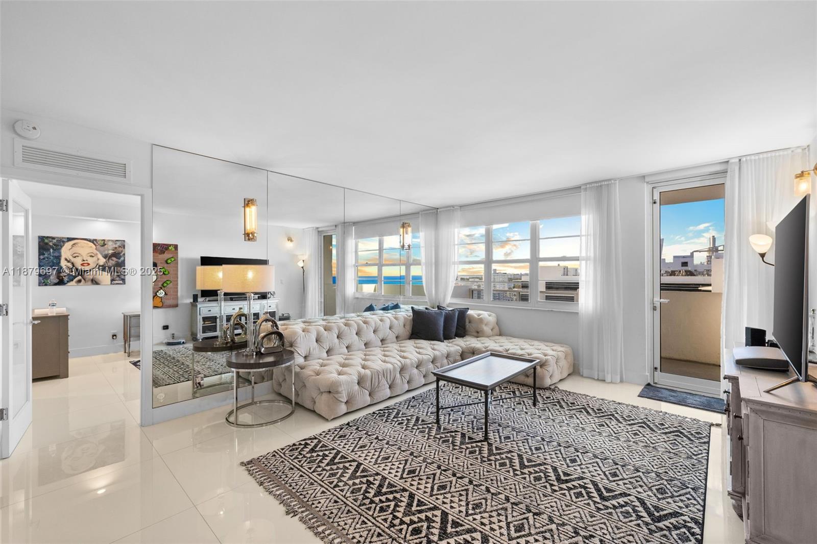 100 Lincoln Road, Unit 1523/1525 Miami Beach, FL 33139 - Photo 9 of 35 a living room with furniture and a flat screen tv