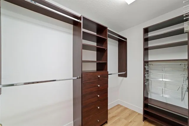 a front view of a house with wooden floor and a window
