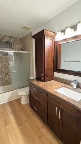 a view of a bathroom from a hallway