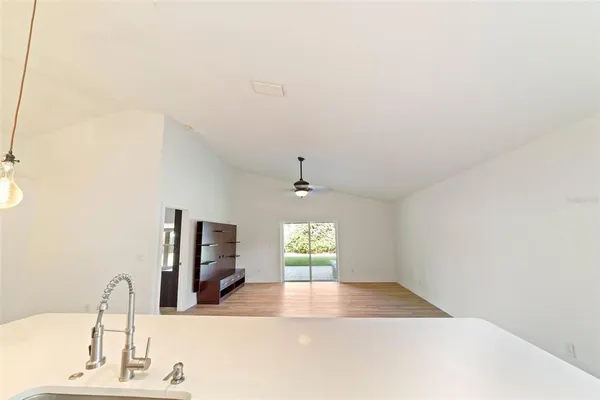 a view of a living room with a sink and a window