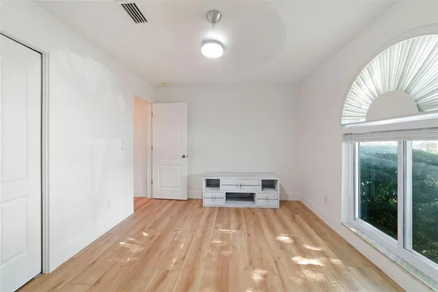 a view of a living room with a sink and a window