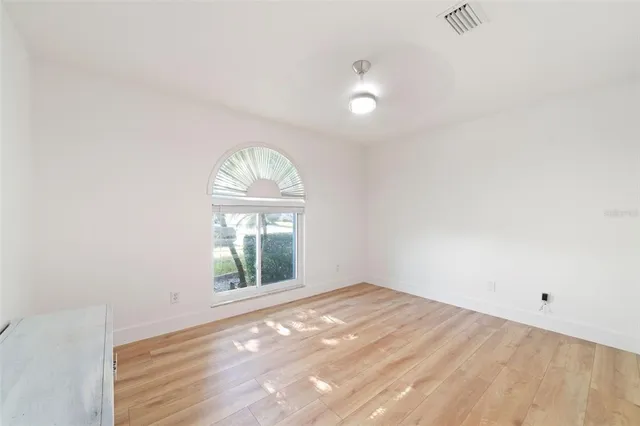 a front view of a house with wooden floor and a window