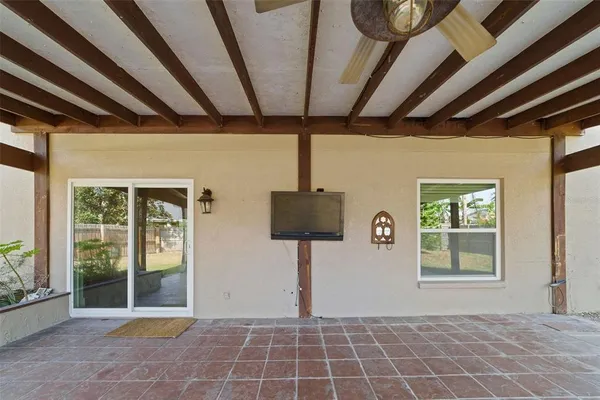 a front view of a house with wooden floor and a window