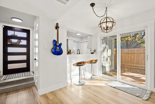 a view of a room with wooden floor and window