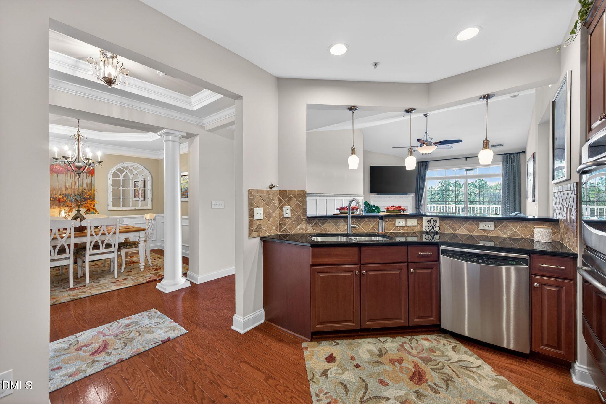10511 Rosegate Court, Unit 305 Raleigh, NC 27617 - Photo 12 of 48 a kitchen with stainless steel appliances granite countertop a sink stove and refrigerator