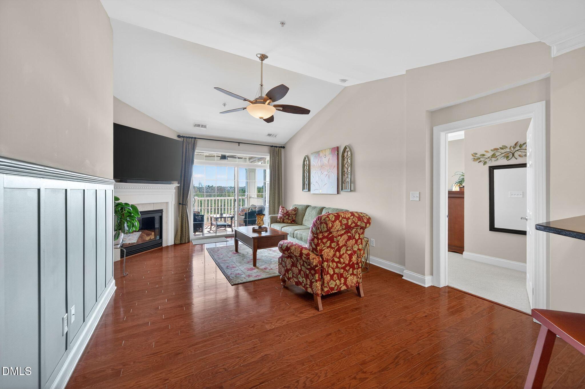 10511 Rosegate Court, Unit 305 Raleigh, NC 27617 - Photo 19 of 48 a living room with furniture fireplace and flat screen tv