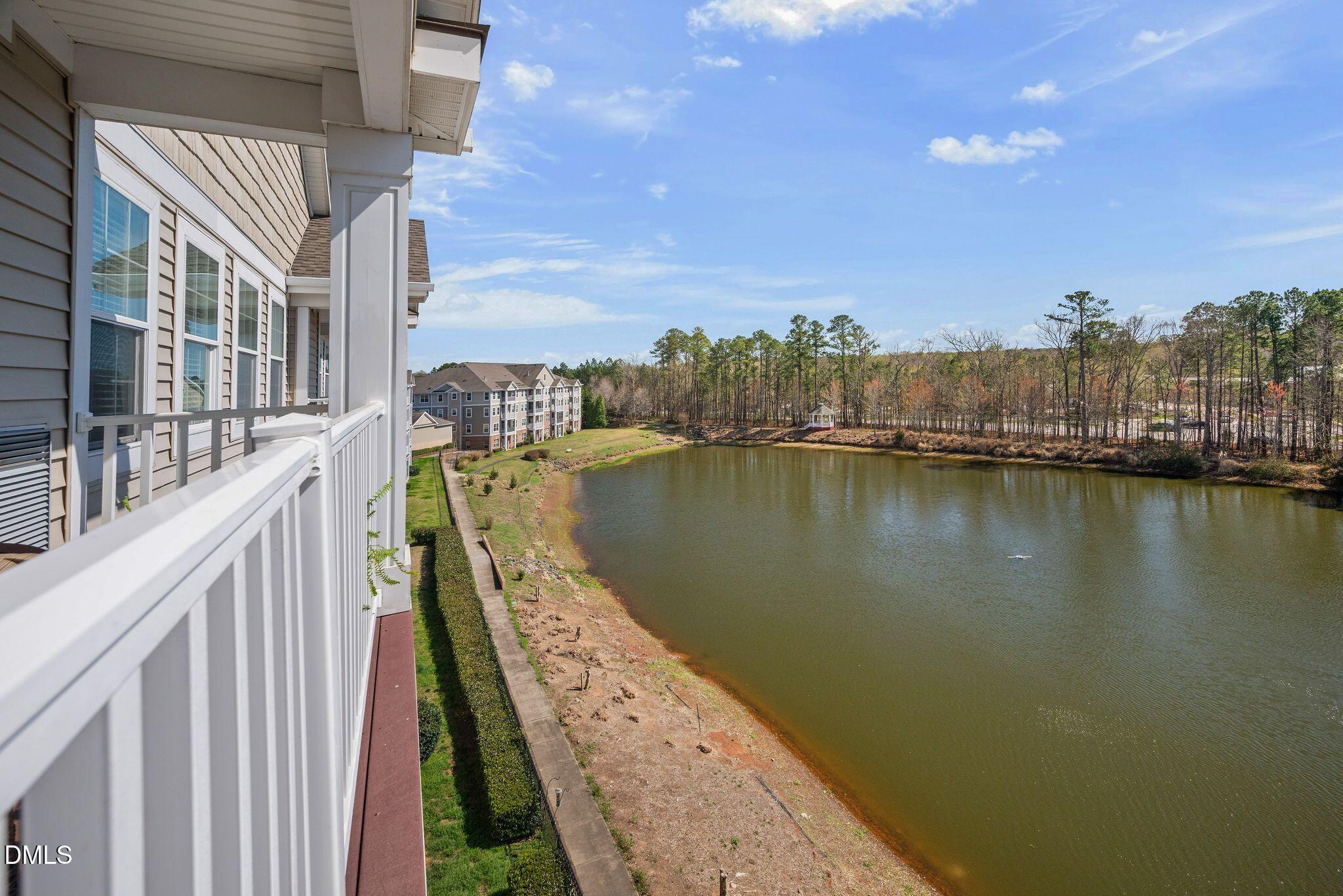 10511 Rosegate Court, Unit 305 Raleigh, NC 27617 - Photo 22 of 48 a view of a city from a lake
