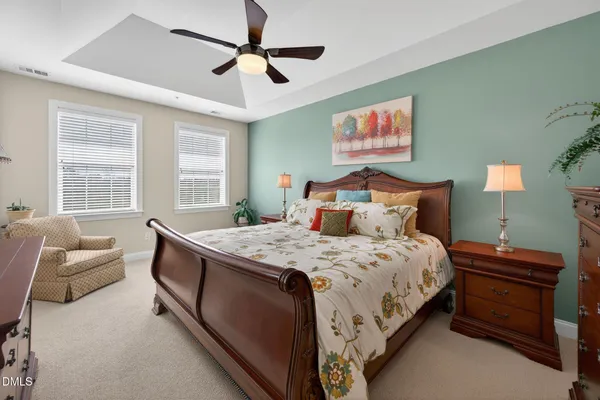 a bedroom with a bed and a couch