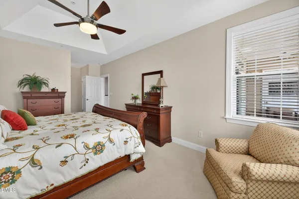 a bedroom with furniture and a window