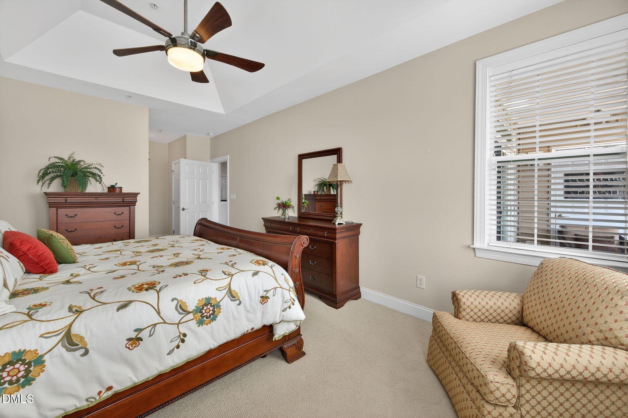 10511 Rosegate Court, Unit 305 Raleigh, NC 27617 - Photo 28 of 48 a bedroom with a bed and a couch